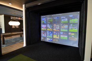 A screen shows a collection of video games.